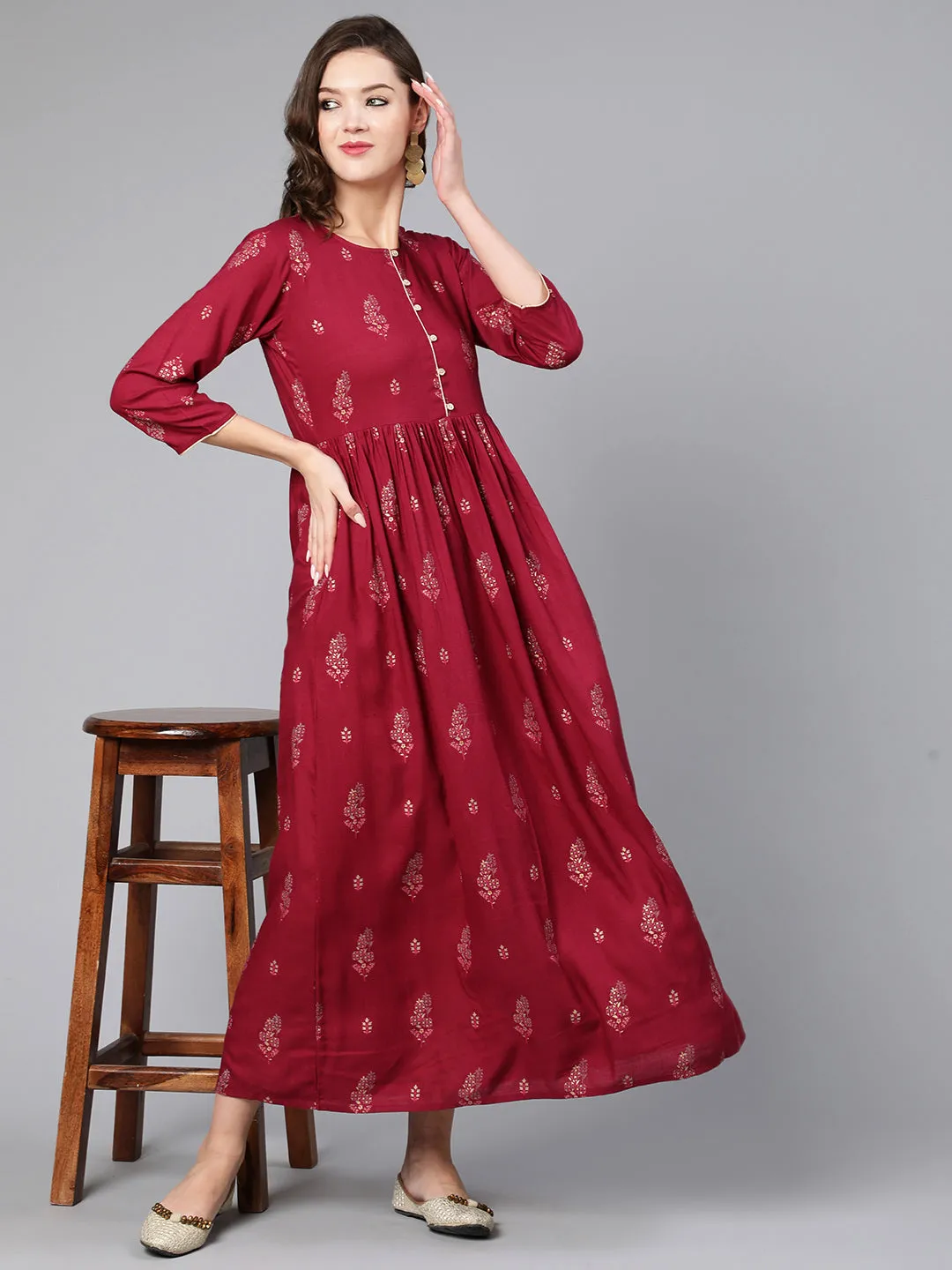 Women Burgundy Printed Flared Dress With Three Quarter Sleeves